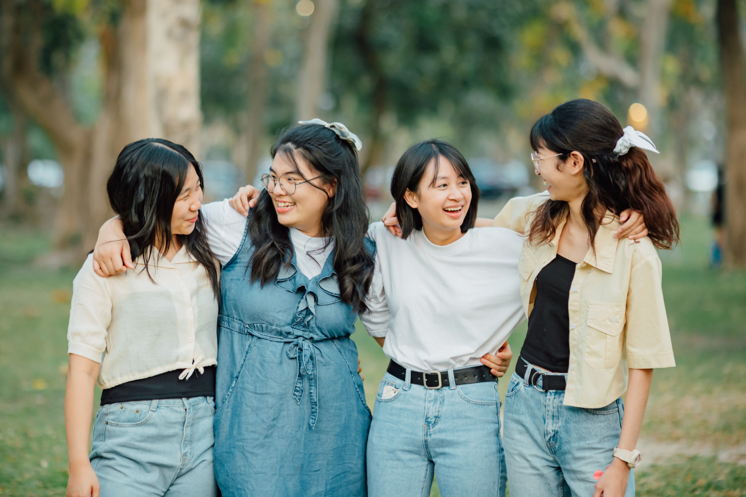 Cheerful girls friends embracing each other