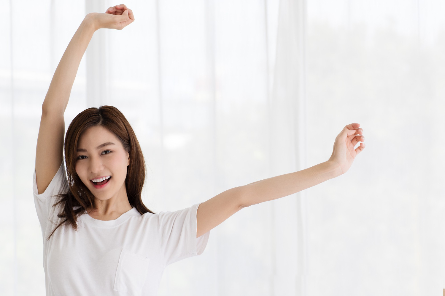 Portrait of beautiful cute young Asian woman smiling with a self-confident and graceful manner