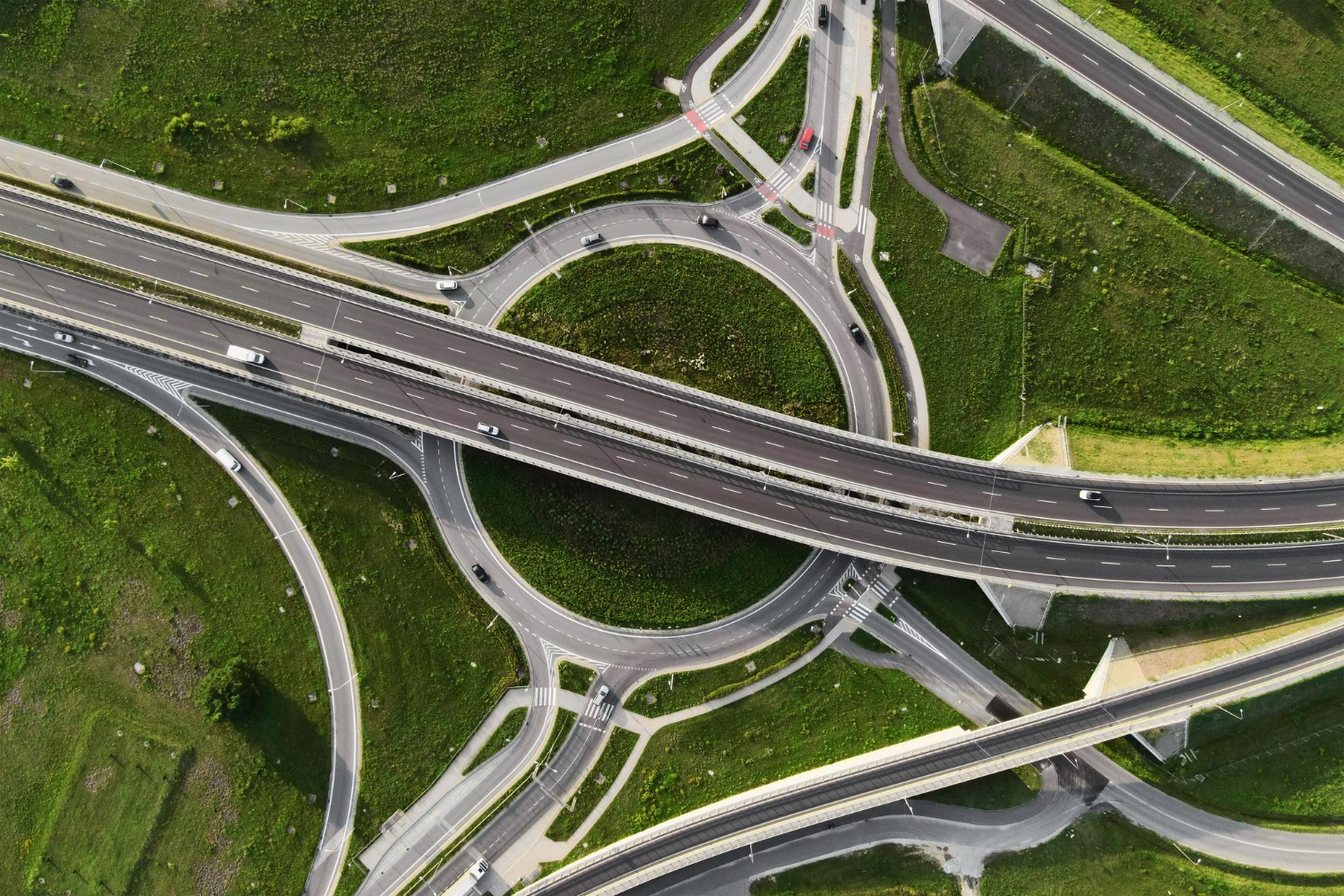 cars driving on round intersection in city